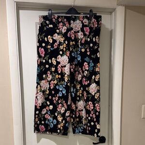 Anthropologie’s The Colette Cropped Floral Pants - Black and Multicolor